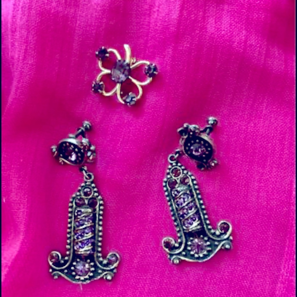 Vintage costume jewelry in gold tones with purple stones.